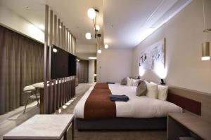Hotel Cordia Osaka Hommachi客房内的一张或多张床位