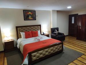 HOTEL VELANEZ SUITE Riobamba客房内的一张或多张床位