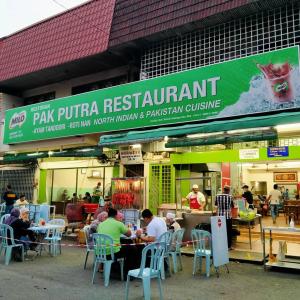 Alimama Guesthouse Melaka with Balcony餐厅或其他用餐的地方