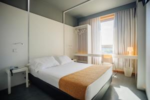布拉加拜席斯基本酒店客房内的一张或多张床位