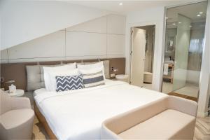Stayso by Cloud7 Hotels客房内的一张或多张床位