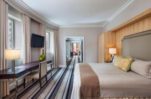 奥米伯沙尔广场酒店客房内的一张或多张床位