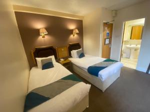 Cardiff Sandringham Hotel客房内的一张或多张床位