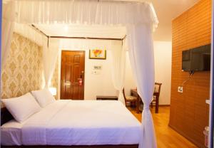 湄公河樱桃2号酒店客房内的一张或多张床位