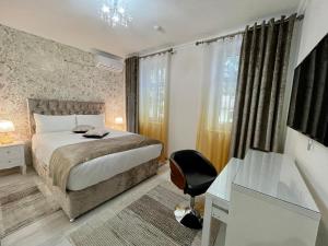 Premier City Apart Hotel Chisinau客房内的一张或多张床位