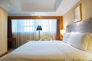 青岛颐中皇冠假日酒店客房内的一张或多张床位
