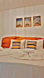 Japaratinga Suites客房内的一张或多张床位