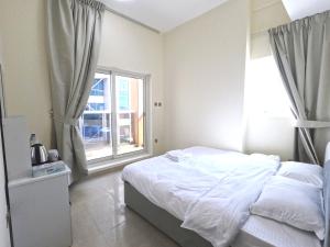 Barsha Star Residence - Home Stay客房内的一张或多张床位