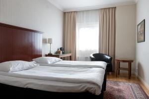 瑞典精英酒店客房内的一张或多张床位