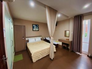 芽庄温馨小家公寓式酒店客房内的一张或多张床位