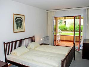 Apartment Parcolago - Utoring-45 by Interhome客房内的一张或多张床位