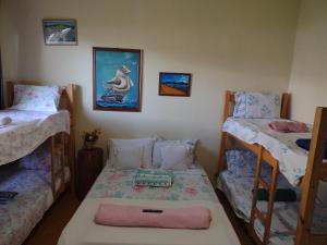 ALOHA - Frente ao Mar - Perto de tudo客房内的一张或多张床位