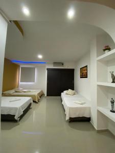 Aparta Hotel El Cacique Upar客房内的一张或多张床位