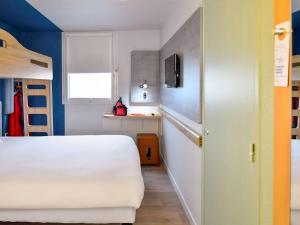 ibis budget Montpellier Sud Près d'Arènes客房内的一张或多张床位