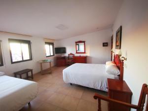 La Quinta De Santillan客房内的一张或多张床位