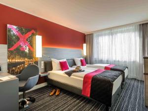 杜塞尔多夫中心区美居酒店客房内的一张或多张床位