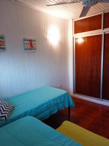 Encantador departamento frente al mar 4 Amb客房内的一张或多张床位