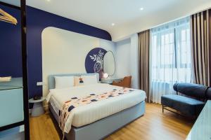 Palette Collect's Boutique Hotel Ha Long客房内的一张或多张床位