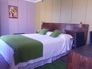 酷贝勒斯阿塔卡马酒店客房内的一张或多张床位