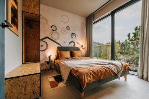 Apartamenty Riders Lodge Szczyrk Kalinowa客房内的一张或多张床位