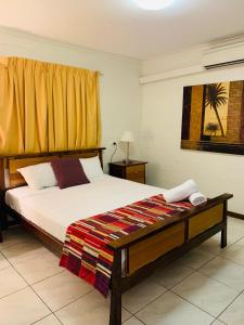 艾尔利海滩公寓式酒店 客房内的一张或多张床位