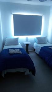Hotel Musto客房内的一张或多张床位