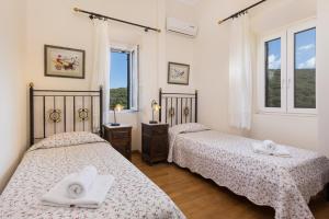 Agallis Corfu Residence客房内的一张或多张床位