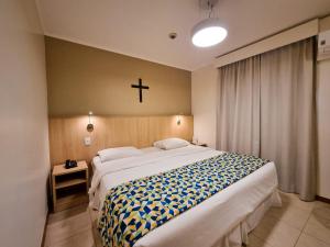 Hotel Rainha dos Apóstolos客房内的一张或多张床位