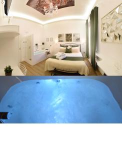 苏尔莫纳Vittorio Veneto Private SPA的卧室前设有大浴缸的房间