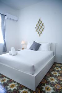Digital Nomad San Agustin Apartments客房内的一张或多张床位