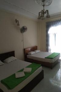 Happy Hotel Binh Chanh客房内的一张或多张床位