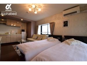 Alphabed Takamatsu Furujinmachi - Vacation STAY 11906客房内的一张或多张床位