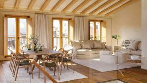 拉科鲁尼亚La Gallega by Upper Luxury Housing的客厅配有桌椅和沙发