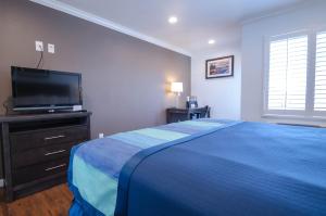 欧陆客栈酒店客房内的一张或多张床位