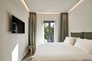 NLH KERAMEIKOS - Neighborhood Lifestyle Hotels客房内的一张或多张床位