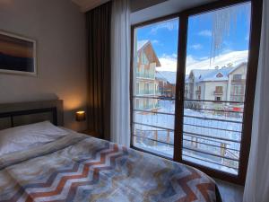 New Gudauri Alpen Apartments客房内的一张或多张床位