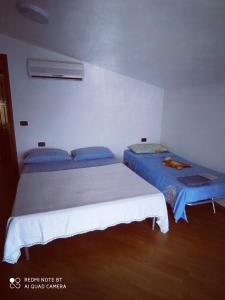 Appartamento in villa stile rustico客房内的一张或多张床位