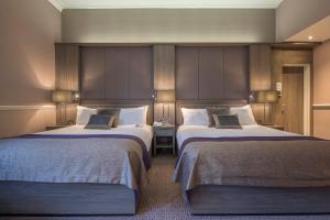 谢菲尔德皇家维多利亚假日酒店客房内的一张或多张床位