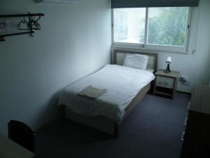 Datacom Guest House客房内的一张或多张床位