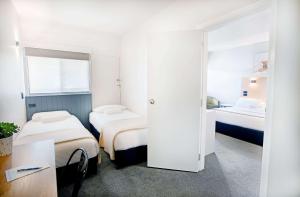 City Centre Motel Armidale客房内的一张或多张床位