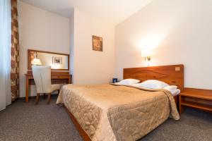 科隆纳布里格塔酒店客房内的一张或多张床位