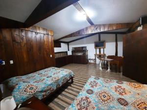 Arenal Xilopalo客房内的一张或多张床位