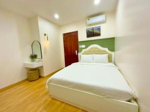 Khải Hoàn Hotel 2客房内的一张或多张床位