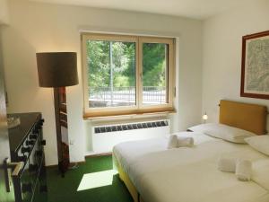 科萨索娜尔皮尼酒店客房内的一张或多张床位