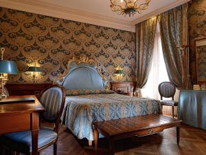 Bellevue Luxury Rooms - San Marco Luxury客房内的一张或多张床位