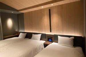 Hotel Keihan Tenmabashi Ekimae客房内的一张或多张床位