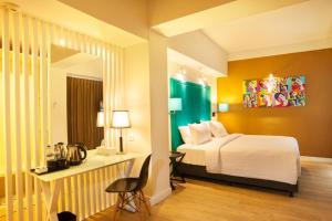 龙目岛爱多普酒店客房内的一张或多张床位