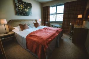 葛洛特里赫耶尔酒店客房内的一张或多张床位