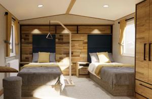 本布里奇Whitecliff Bay Holiday Park的一间卧室设有两张床和木墙