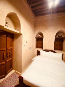 Jawharat Alaqar Inn نزل جوهرة العقر客房内的一张或多张床位